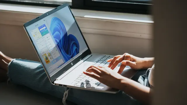 Person working on Windows 11 computer (Photo by Windows on Unsplash)